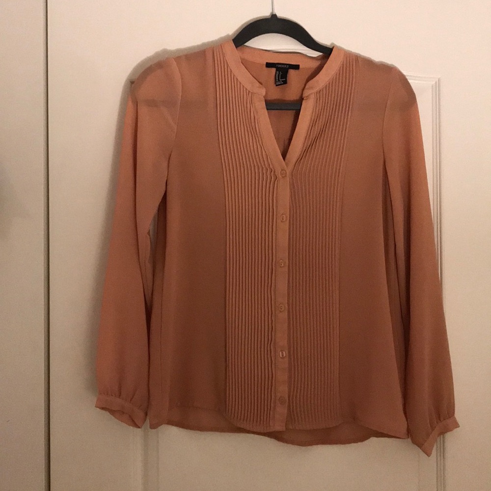 Tan business casual long sleeved top.